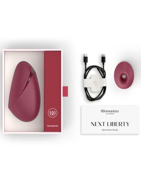Womanizer - next estimulador de clítoris por succión 14 niveles burdeos